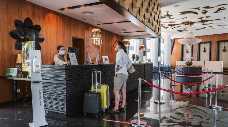 Tourists at the reception of a hotel in the Canary Islands