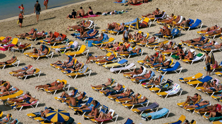 Turistas en la playa, Islas Canarias